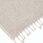 Ozoola Waffle beach towel in grey with tassles