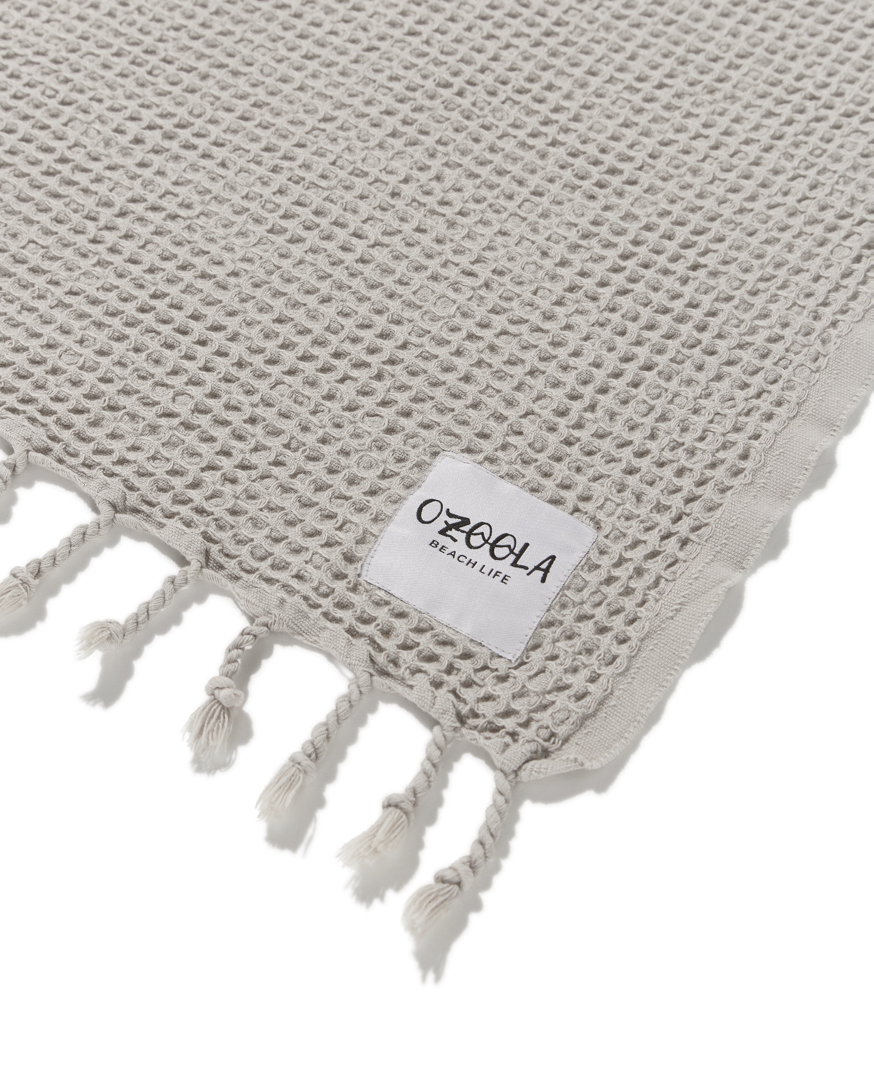 Ozoola tag Waffle family beach blanket in sand