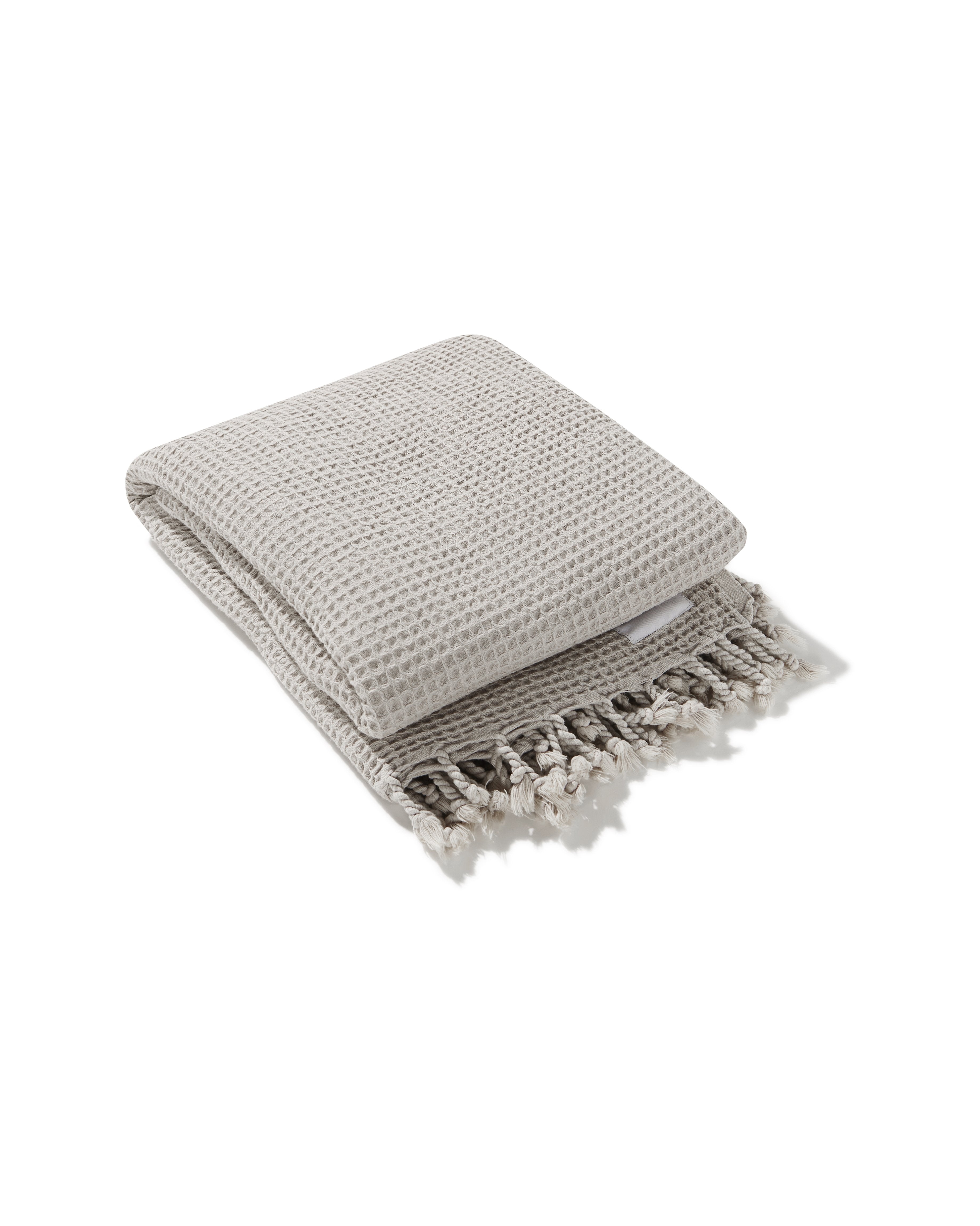 Ozoola tassled Waffle family beach blanket in sand
