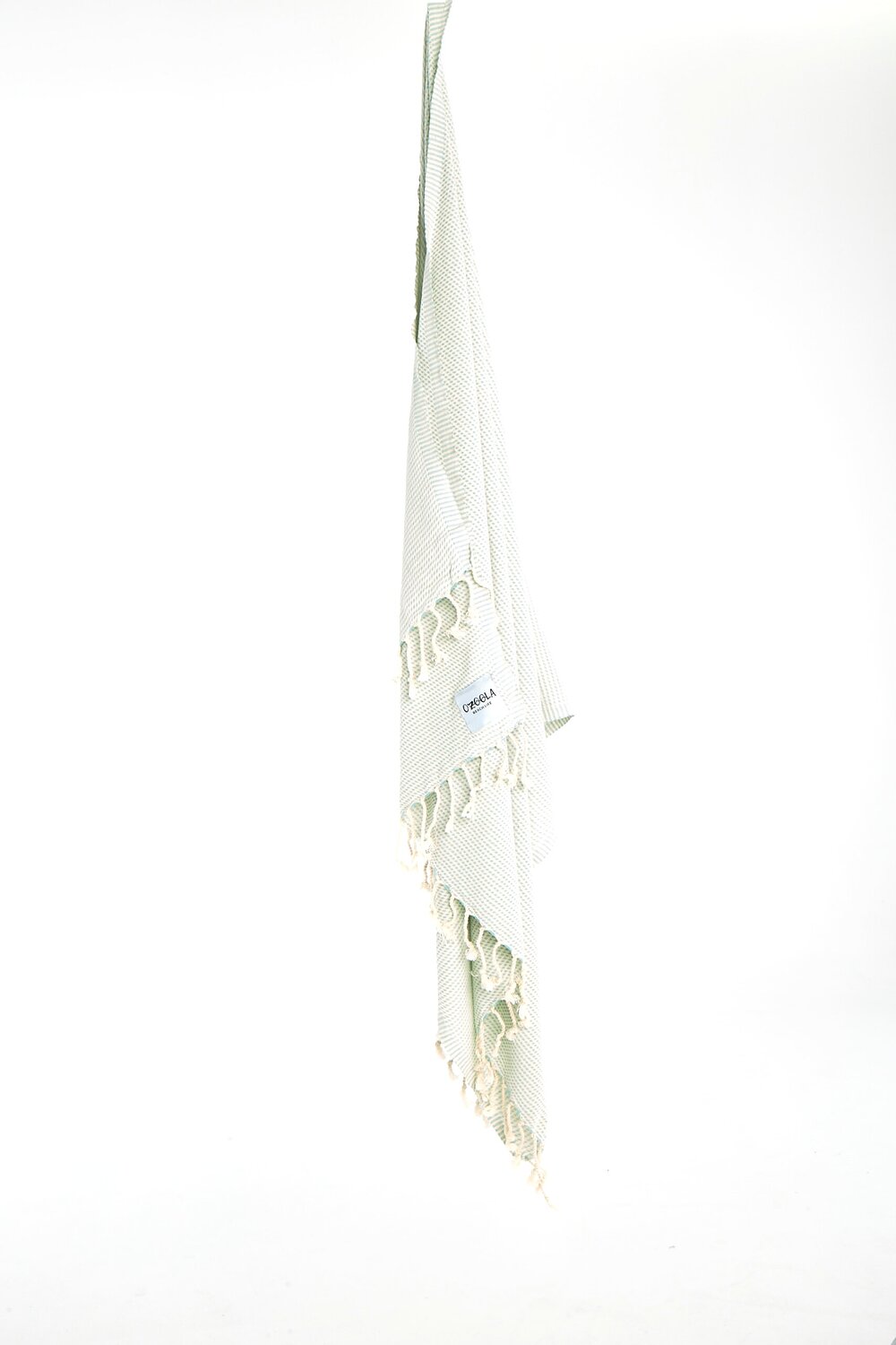 Ozoola Turkish beach towel in baby blue hanging