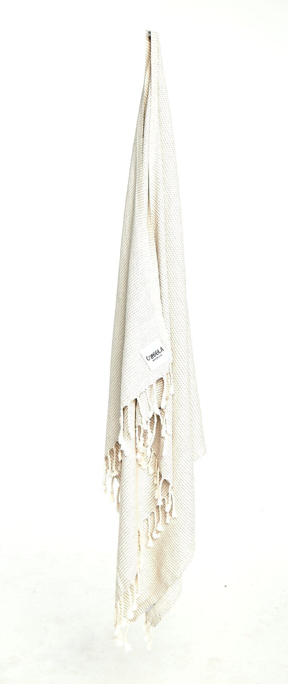Ozoola Turkish beach towel in grey hanging