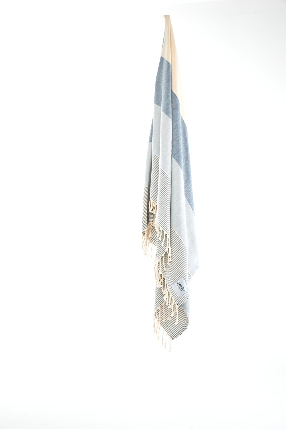 Ozoola Johnny Turkish beach towel in blue hanging