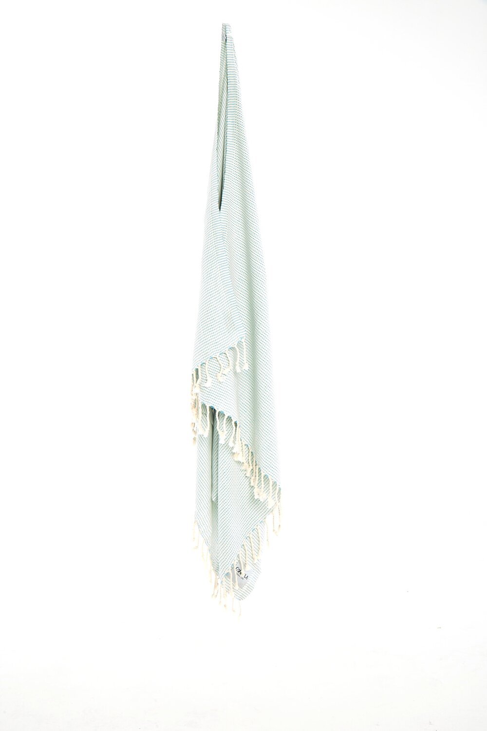 Ozoola Turkish beach towel in mint hanging