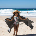 Child on beach with Ozoola Turkish beach towel