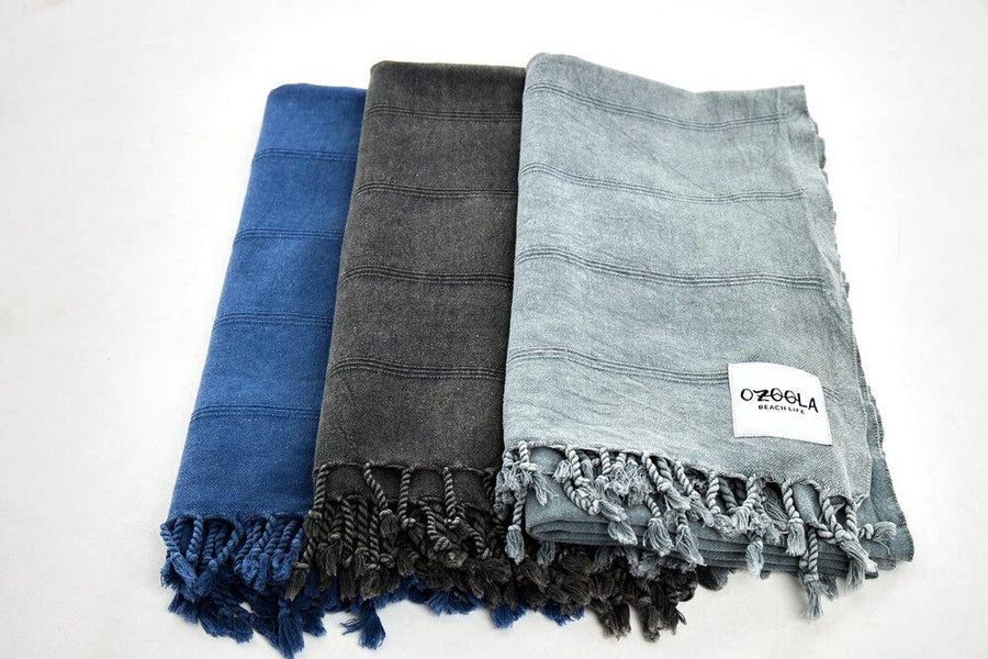 Ozoola Turkish beach towels in charcoal, blue and grey stonewash